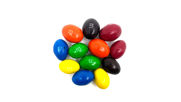 Milk chocolate [sugar, cocoa butter, cocoa mass, milk ingredients (milk), lactose, peanuts (peanuts), soy lecithin (soy), salt, flavour], Sugars (sugar, dextrose, corn syrup), Peanut butter [partially defatted peanuts (peanut), palm oil], Modified palm and sunflower oils and/or hydrogenated palm kernel oil, Cornstarch, Flavour, Salt, Tapioca dextrin, Carnauba wax, Propyl gallate, Gum acacia, Titanium dioxide, Brilliant blue FCF (FD&C Blue No. 1), Sunset yellow FCF (FD&C Yellow No. 6), Allura red (FD&C Red No. 40), Tartrazine (FD&C Yellow No. 5), Indigotine (FD&C Blue No. 2).